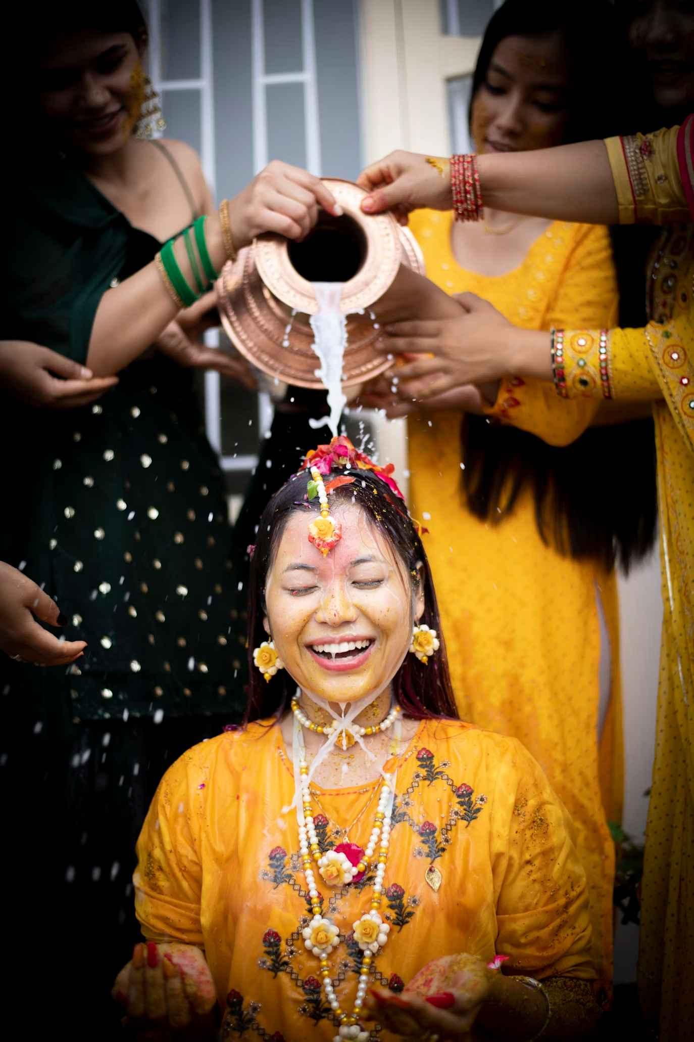 Bride enjoting her haldi ceremony.